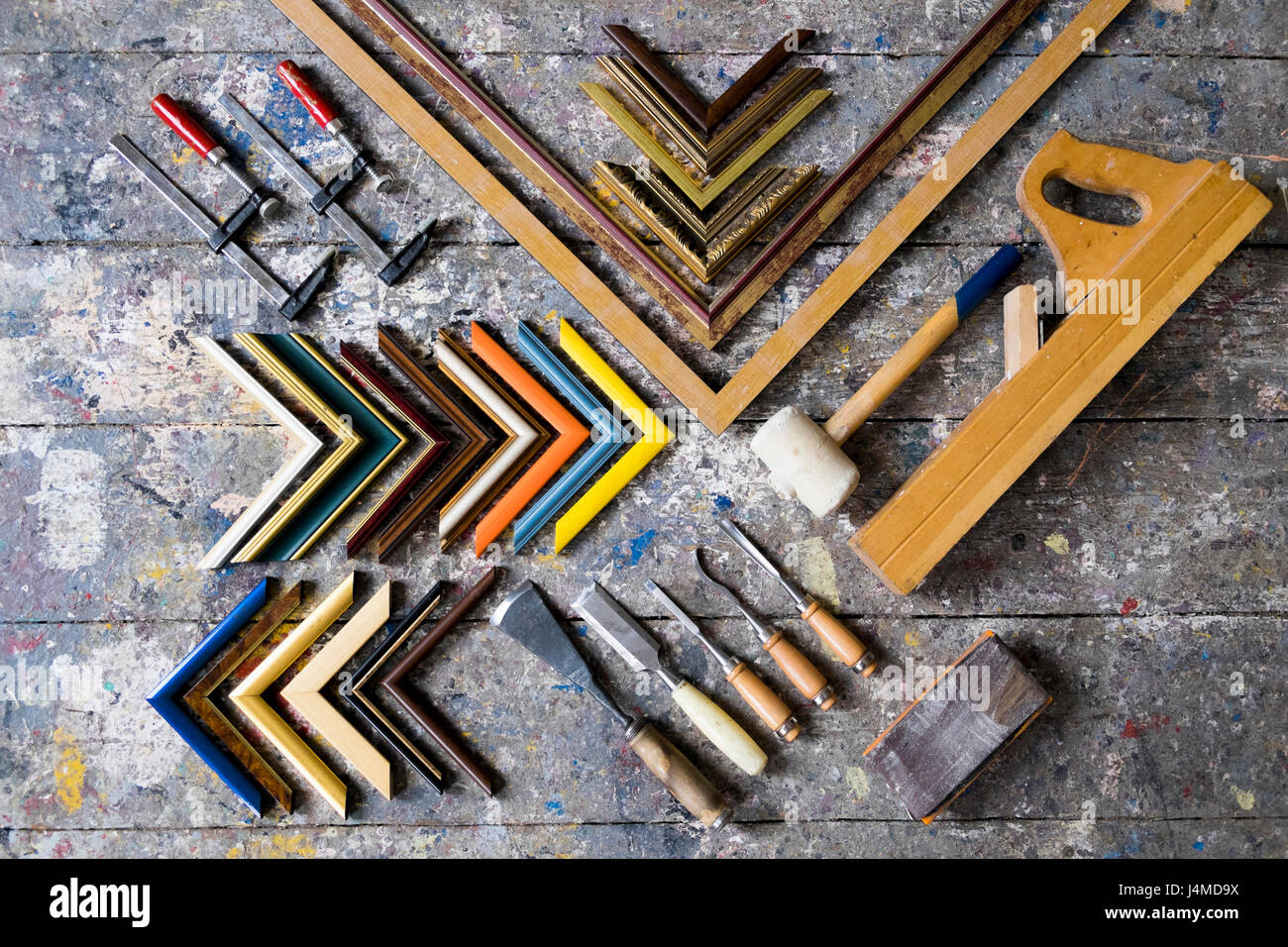 Picture frame tools on splattered table Stock Photo