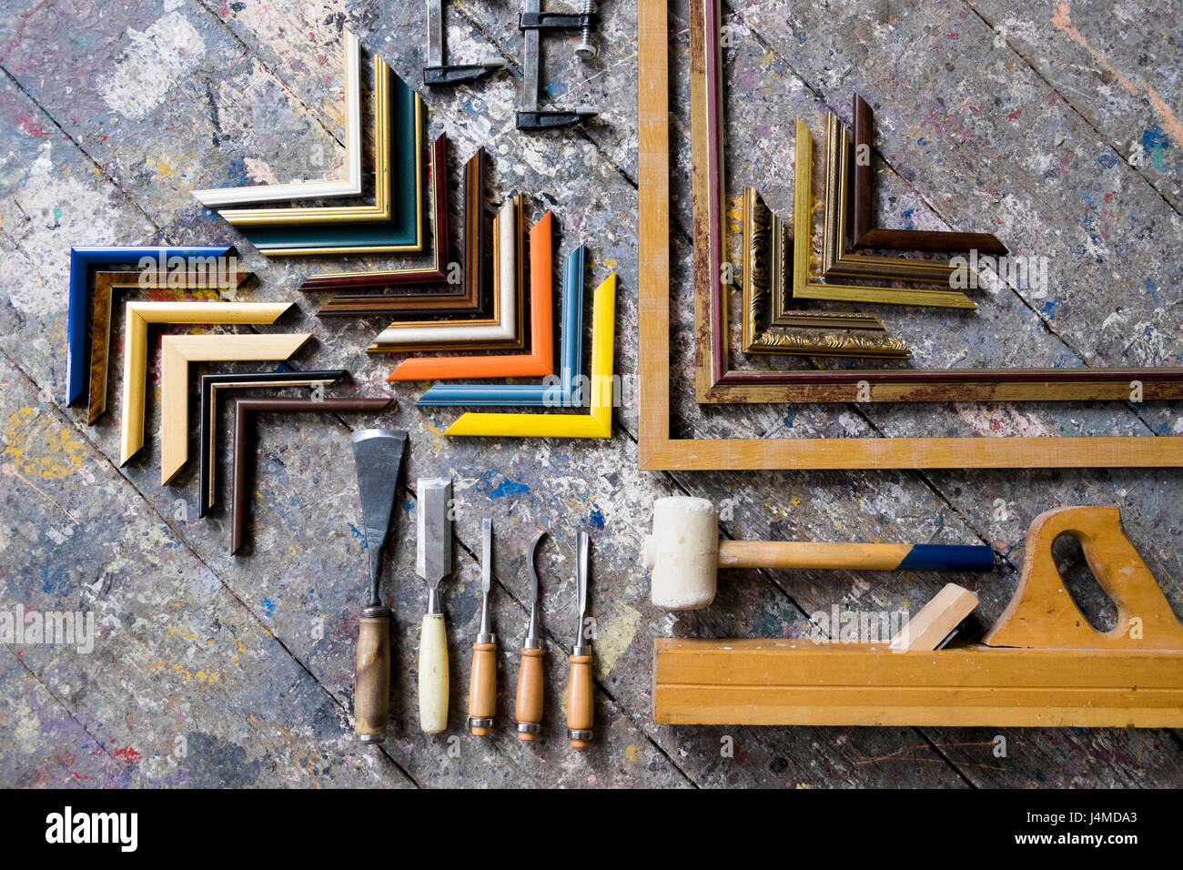 Picture frame tools on splattered table Stock Photo