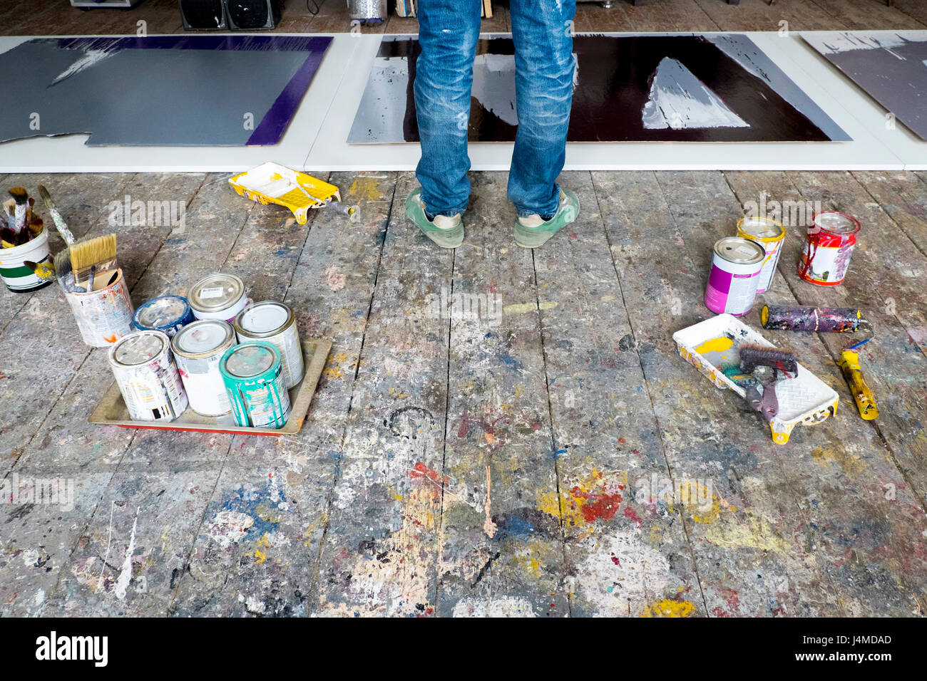 Caucasian artist painting in art studio Stock Photo
