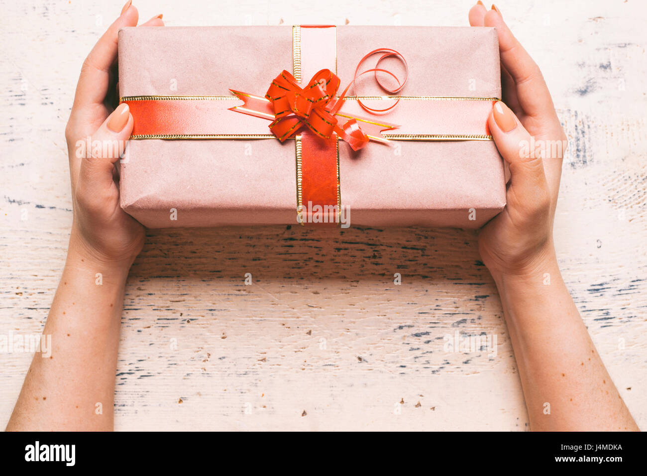 Hands of woman holding gift box Stock Photo