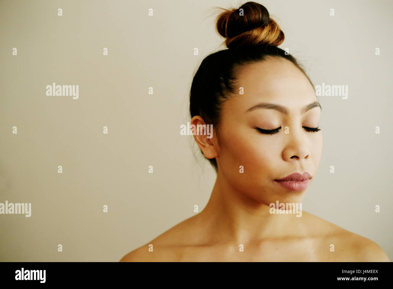 Portrait of Asian woman with eyes closed Stock Photo - Alamy