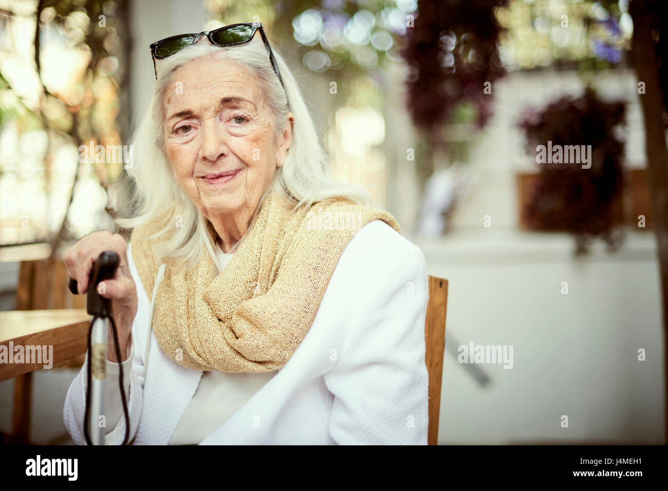 Portrait of smiling older Caucasian woman wearing scarf Stock Photo