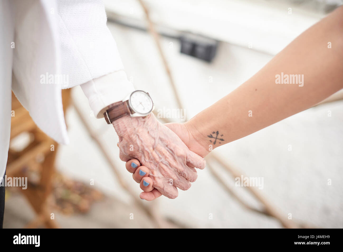 Grandmother and granddaughter holding hands Stock Photo