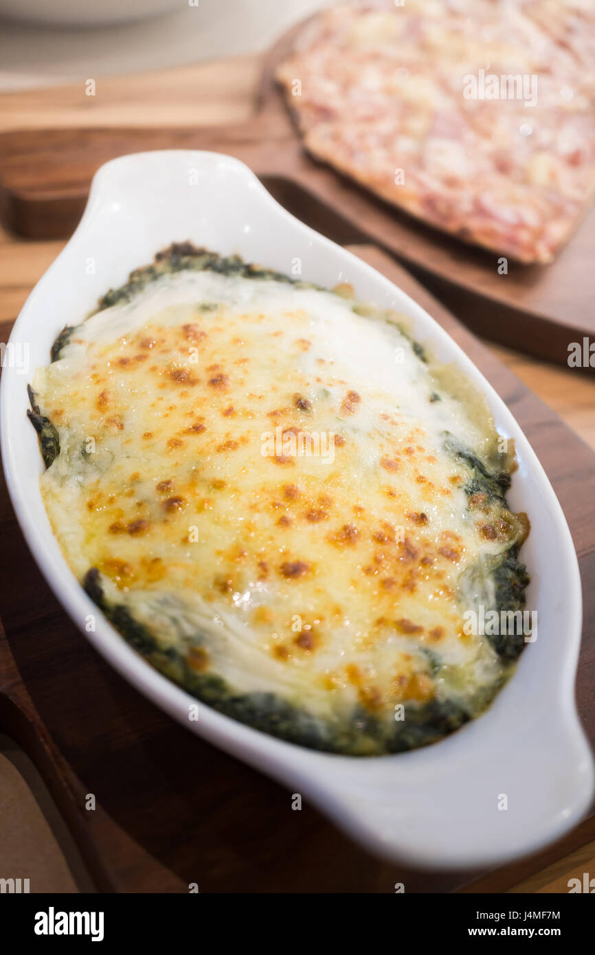 Baked spinach with cheese Stock Photo - Alamy
