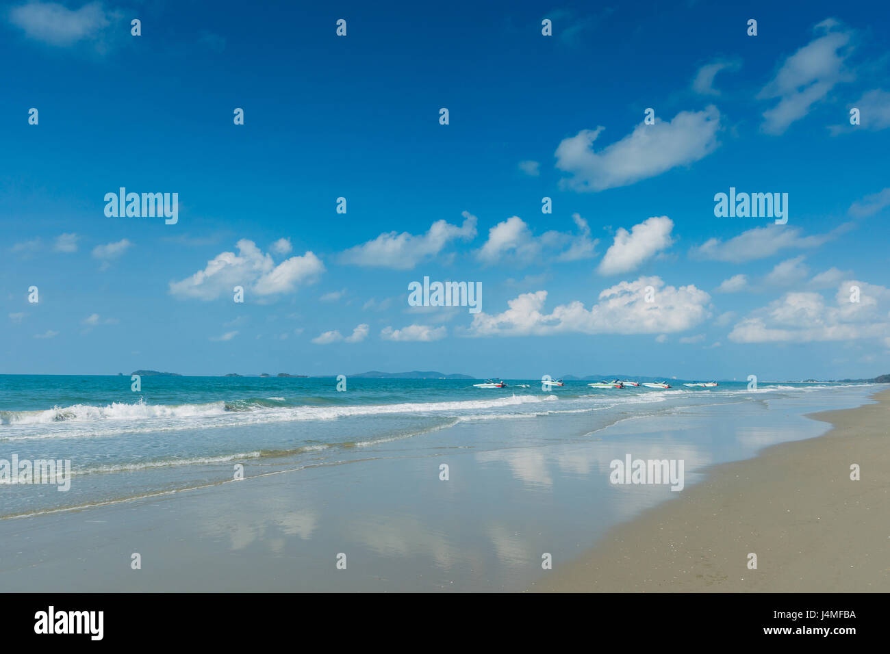 Tropical beach with clear water , blue sky and speed boats Stock Photo ...