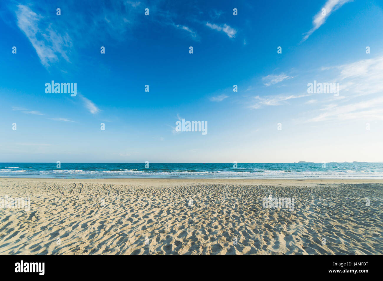 Tropical beach with clear water and blue sky Stock Photo - Alamy