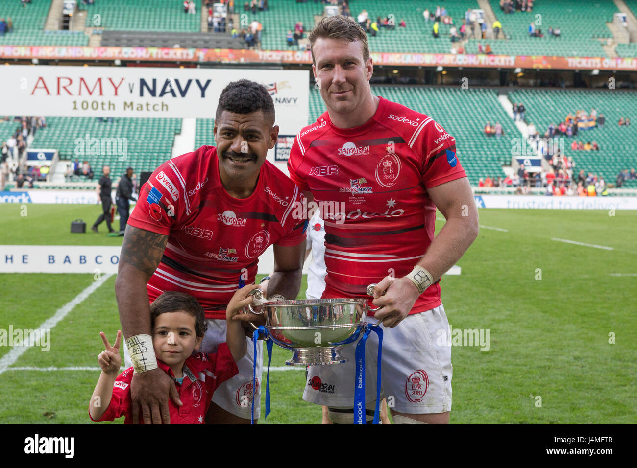 Man of the match Junior Bulumakau and team captain Rob Lennox with the Inter Services Cup following the Army's win over the Navy rugby team at Twicken Stock Photo
