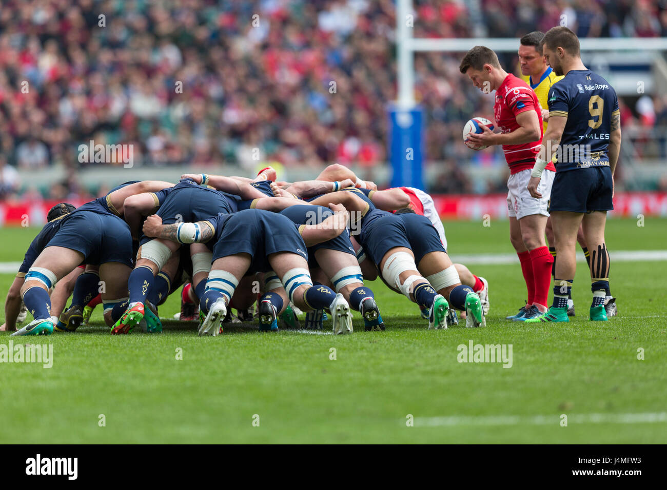 A rugby scrum is ready for the scrum half to put the ball in Stock