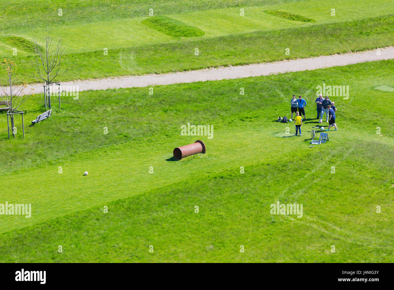 INDEN - MAY 5: Aerial view of a small group of people playing soccer golf on a green lawn on May 5, 2016. Stock Photo