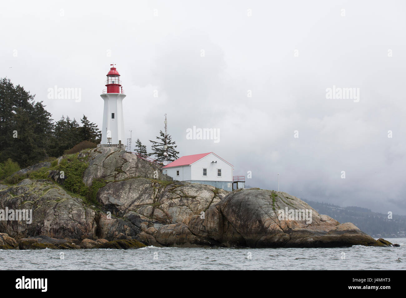 Point Atkinson Light Station National Historic Site on the Howe Sound near Vancouver, Canada. The point of interest in within Lighthouse Park. Stock Photo