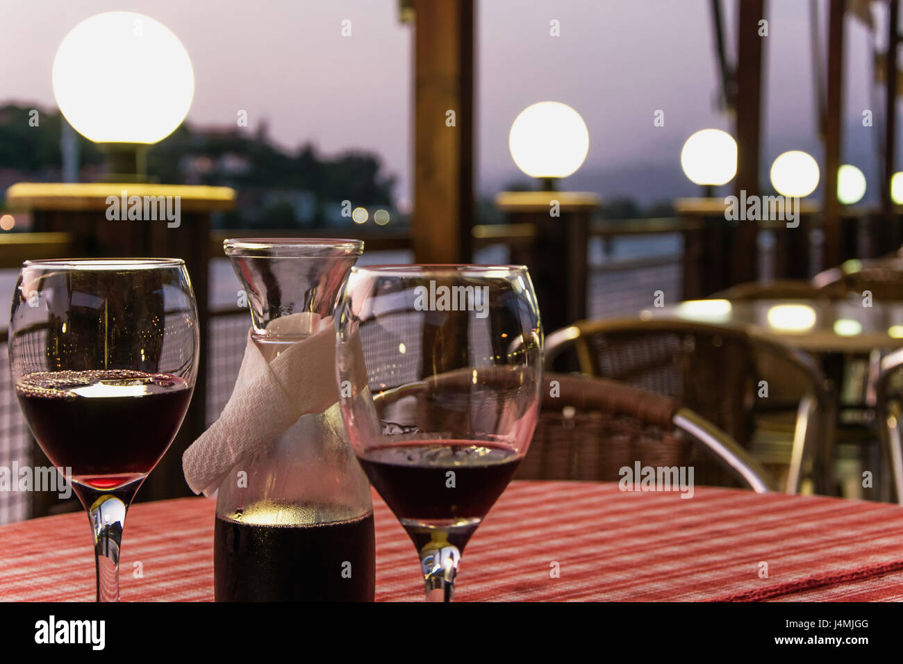 Drinking wine at an outdoor restaurant Stock Photo - Alamy