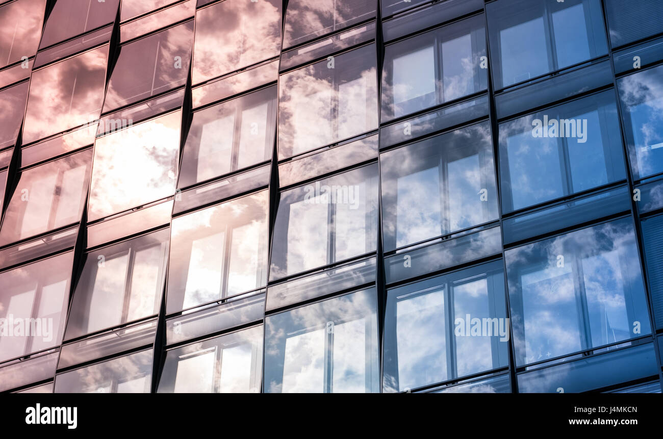 modern office building facade with sky and clouds reflection Stock ...