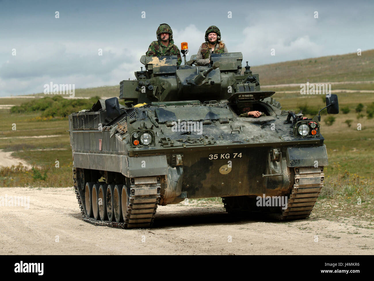 A British Army Warrior armed personnel vehicle on Salisbury Plain, Wiltshire, UK Stock Photo