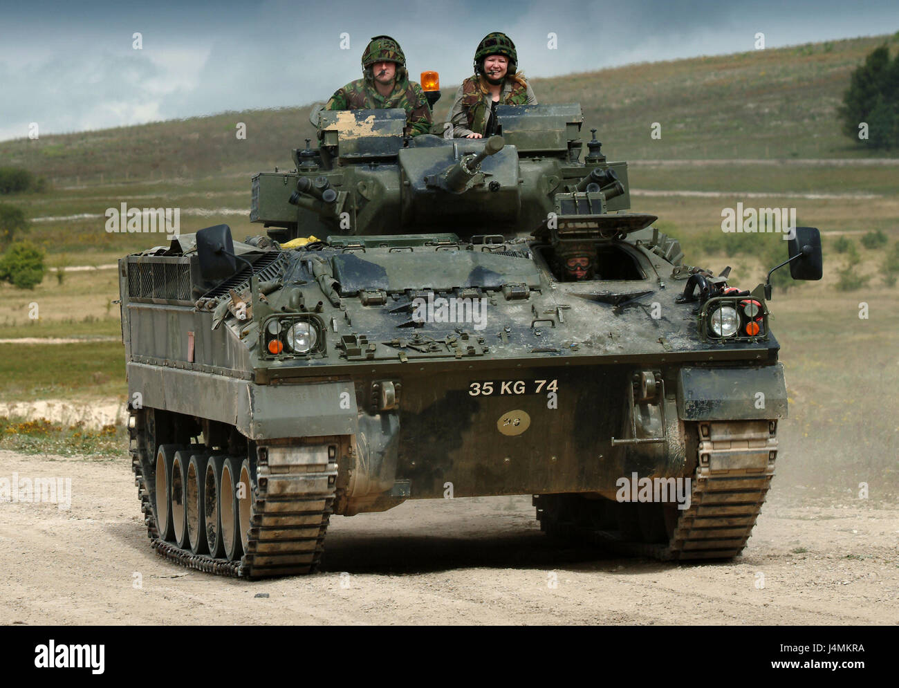 A British Army Warrior armed personnel vehicle on Salisbury Plain, Wiltshire, UK Stock Photo