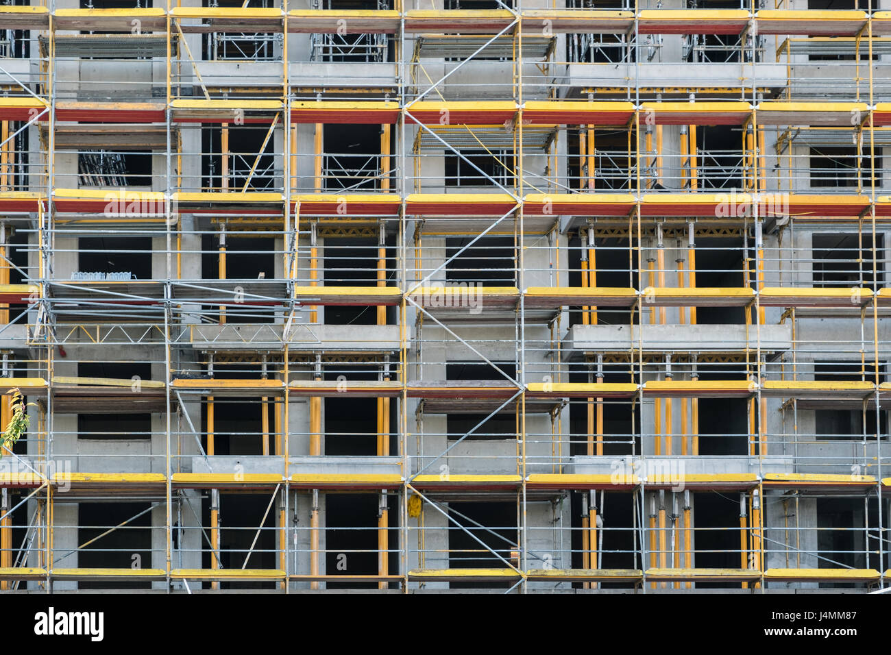 scaffolding on facade - building under construction Stock Photo - Alamy