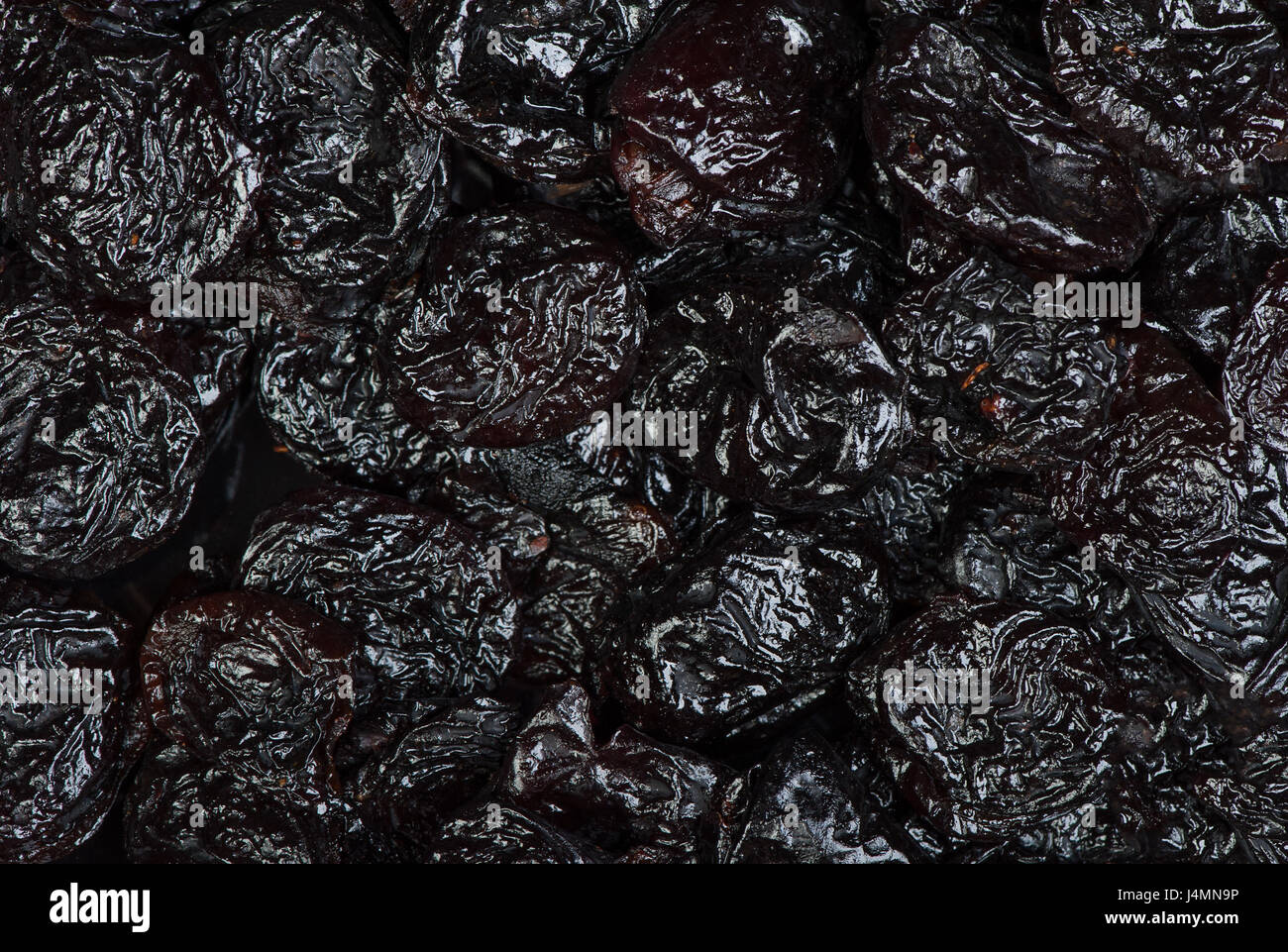 Top view of prunes as background texture Stock Photo - Alamy