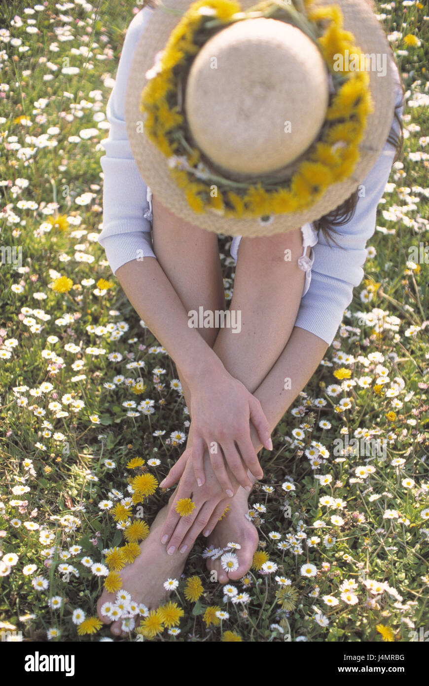 Spring, woman, straw hat, head, lowered, flower meadow, sit spring meadow, single, 30 years, détente, rest, rest, rest, take it easy, nature, leisure time, vacation, enjoy Stock Photo