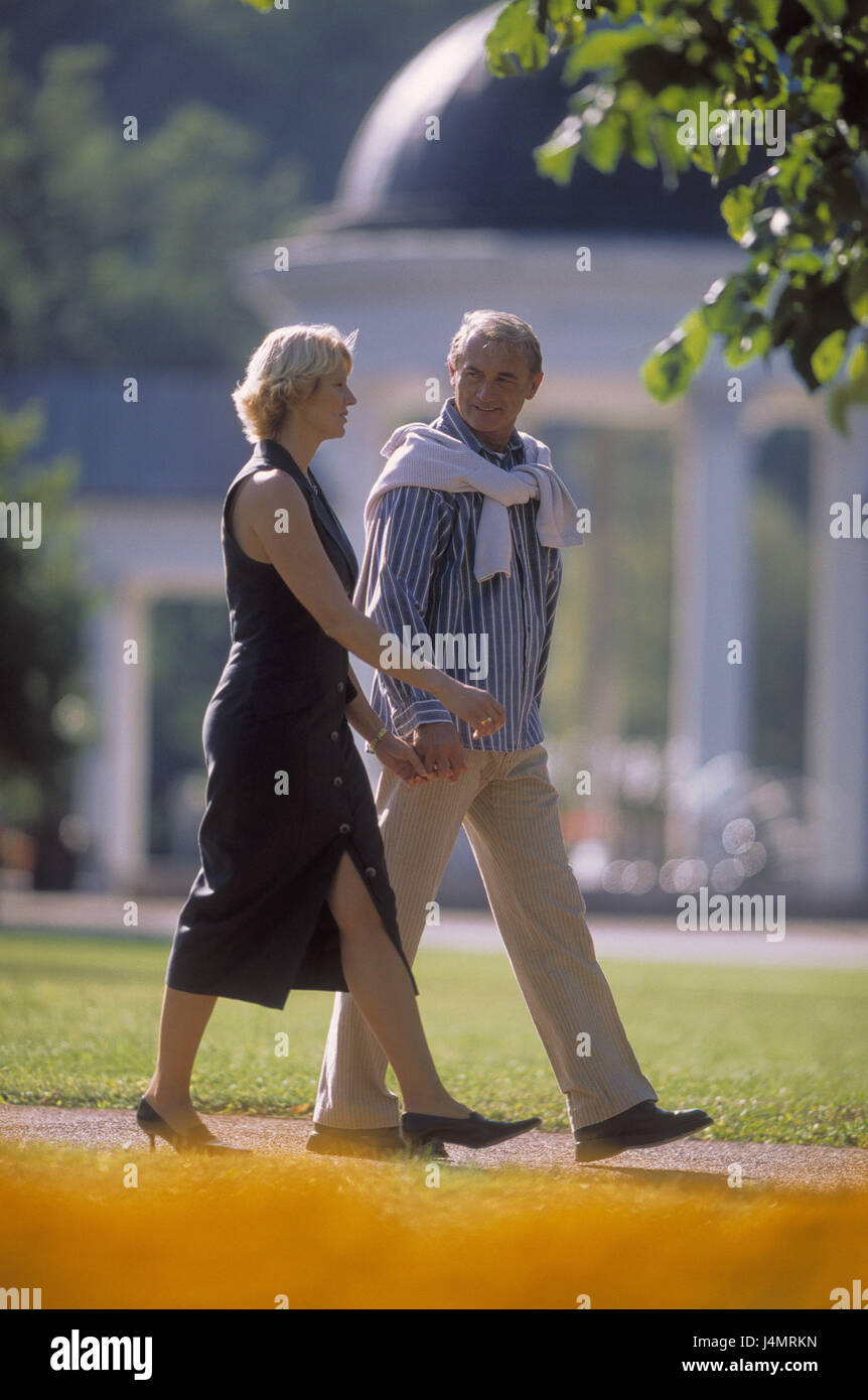 Park, couple, middle old person, walk, summer 45 - 55 years, partnership, respect, leisure time, go for a walk, hold together, hands, there falls in love, love, affection, flower, rose, eye contact, amusement, activity, motion, park, meadow, 40-50 years, 50-60 years Stock Photo