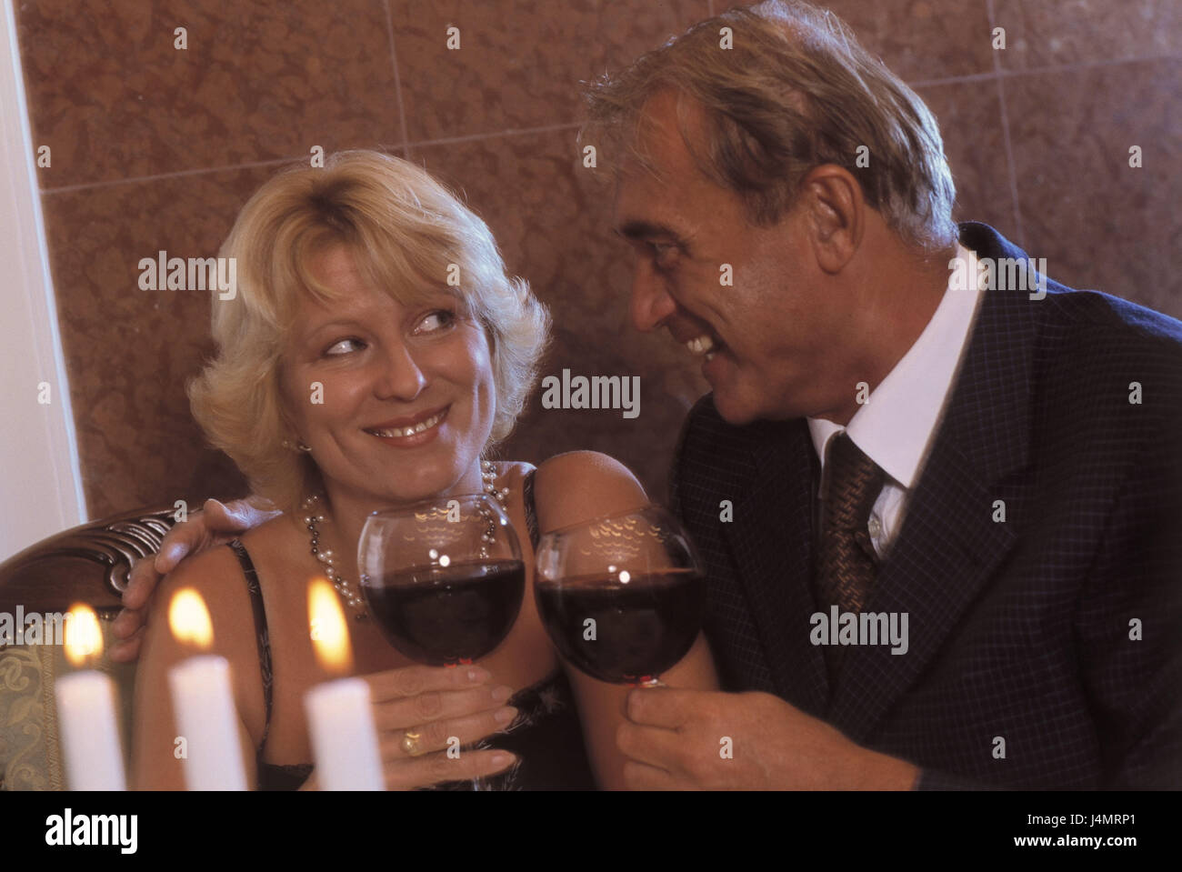 Couple, middle old person, wineglasses, kick off, happily partnership, 45 - 55 years, dates, respect, falls in love, love, affection, allowance, wine, red wine, drink, raise the glass, laugh, eye contact, flirtation, flirt, happily, joy, contently, lifestyle, tuning, inside, 40-50 years, 50-60 years Stock Photo