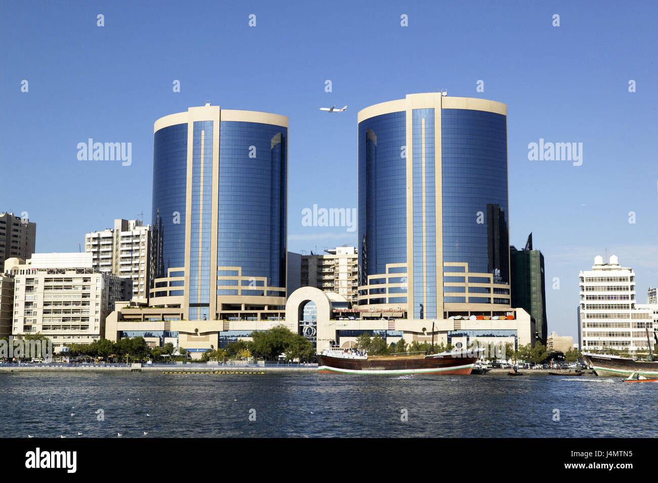 United Arab Emirates, Dubai, town view, Deira, Twin of Tower, harbour VAE, Arabian peninsula, the Middle East, capital, Dubai Creek, Al-Khor harbour, structures, buildings, two, builds in 1998, architect Leo A. Daly, glass fronts, reflector facades, architecture, place of interest, outside Stock Photo