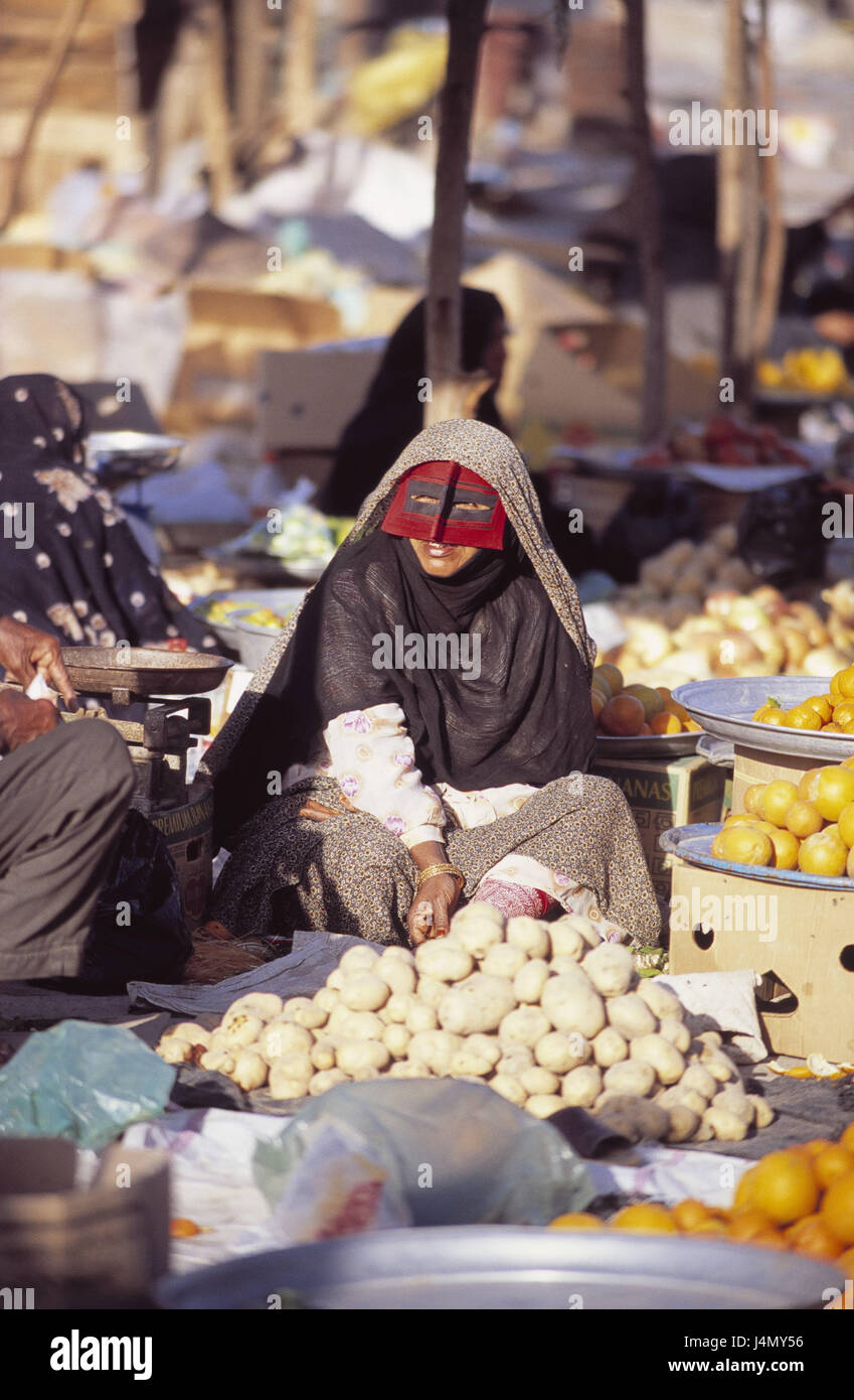 Iran, Bandar Abbas, market, woman, veils, portrait no model release! The Near East, person, locals, women, Iranian, clothes, traditionally, chador, chador, veil, facial veil, mask, substance mask, red, headscarf, Islam, faith, religion, the Persian Gulf, food, sales, fruit, vegetables Stock Photo