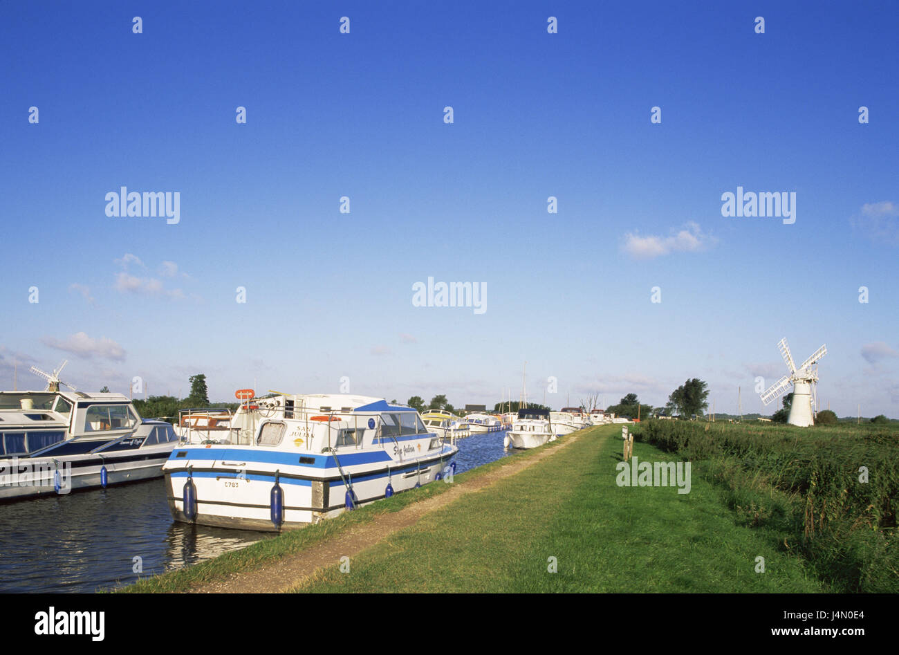Great Britain, Norfolk, River Thurne, boats, riversides, windmill, England, river scenery, scenery, mill, structure, place of interest, river, waters, boats, anchor, invest, destination, tourism, Stock Photo
