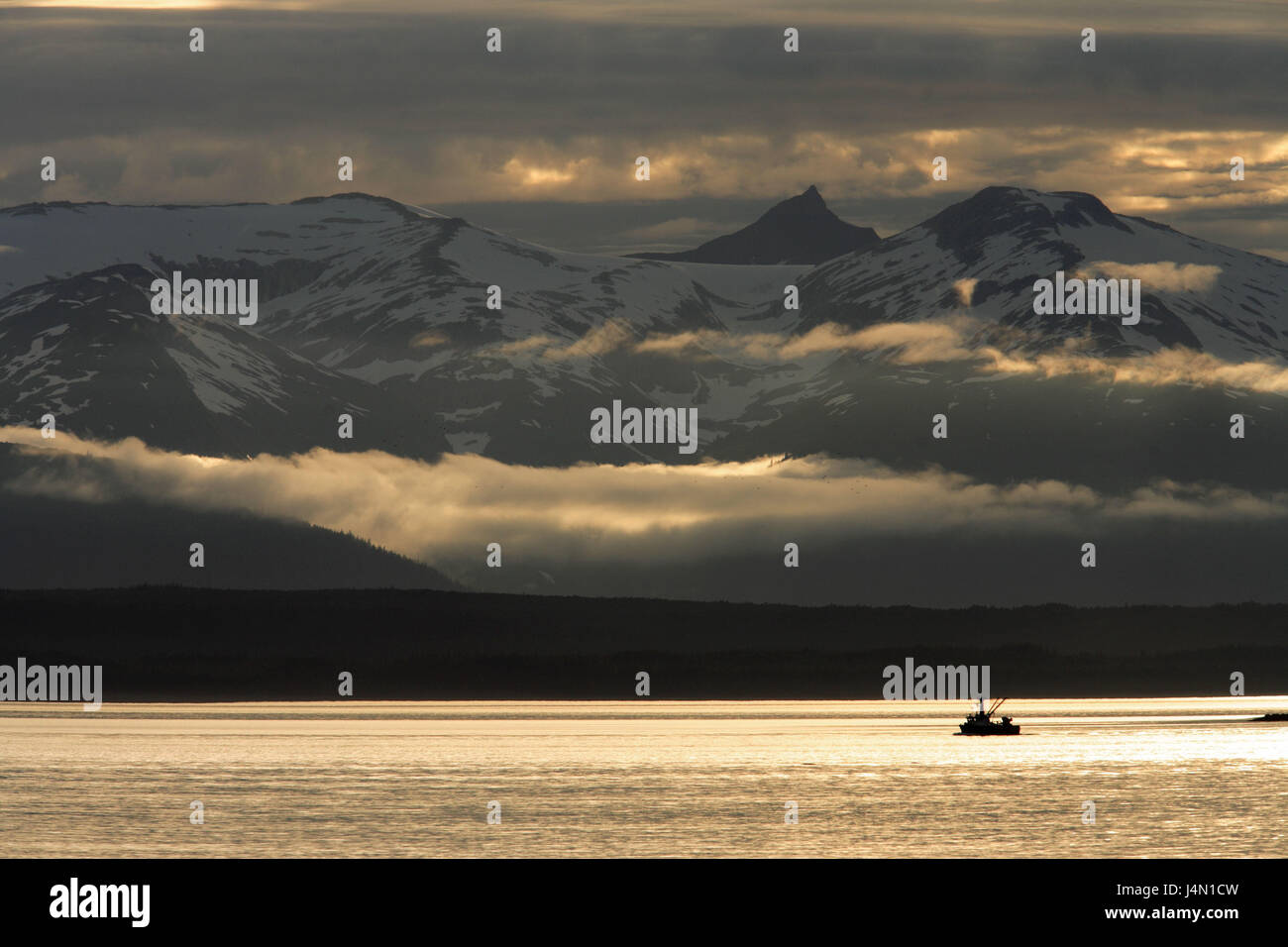 The USA, Alaska, Lynn Canal, Coast Mountains, fishing boat, dusk, Stock Photo