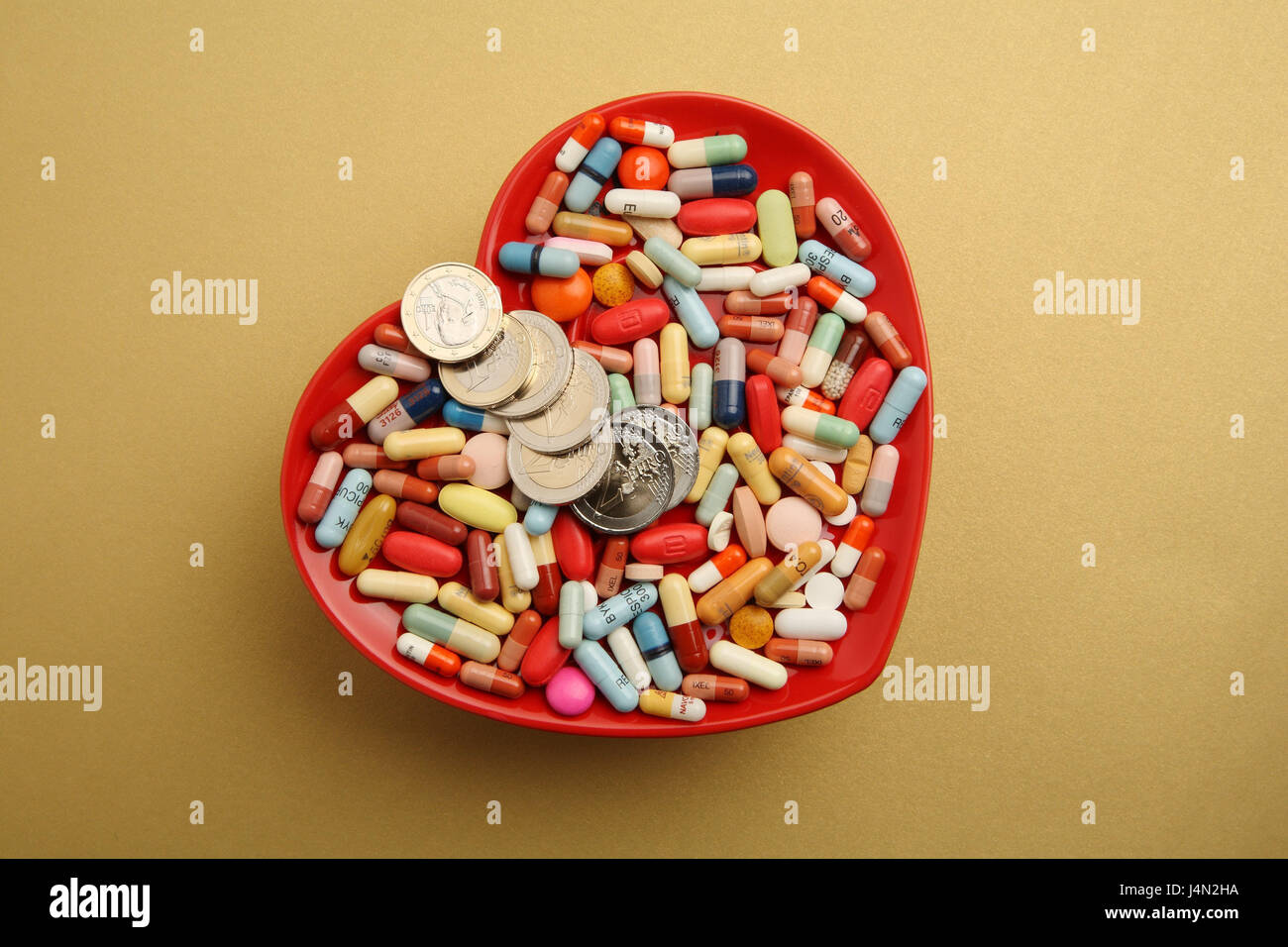 Peel, heart form, drugs, differently, money, coins, the pills, tablets, dragée, importantly to survival, Pharma, dose, overdose, health, disease, heart desease, heart ailment, heart, consumption, mania, tablet mania, brightly, medicine, change, icon, expenses, disease expenses, capacities, additional payment, studio, copy square, object photography, Stock Photo