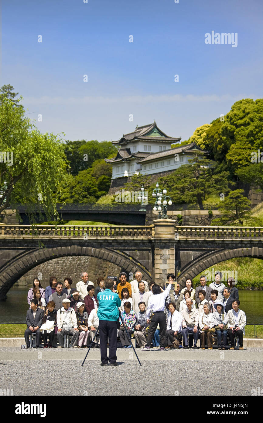 Japan, Tokyo, imperial palace, river, arched bridge, tour group, photographer, Stock Photo