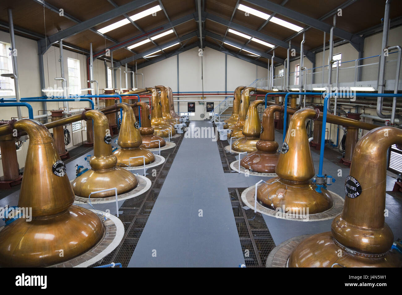 Great Britain, Scotland, Dufftown, Glenfiddich whisky Distillery, fuel hall, copper boiler, Stock Photo