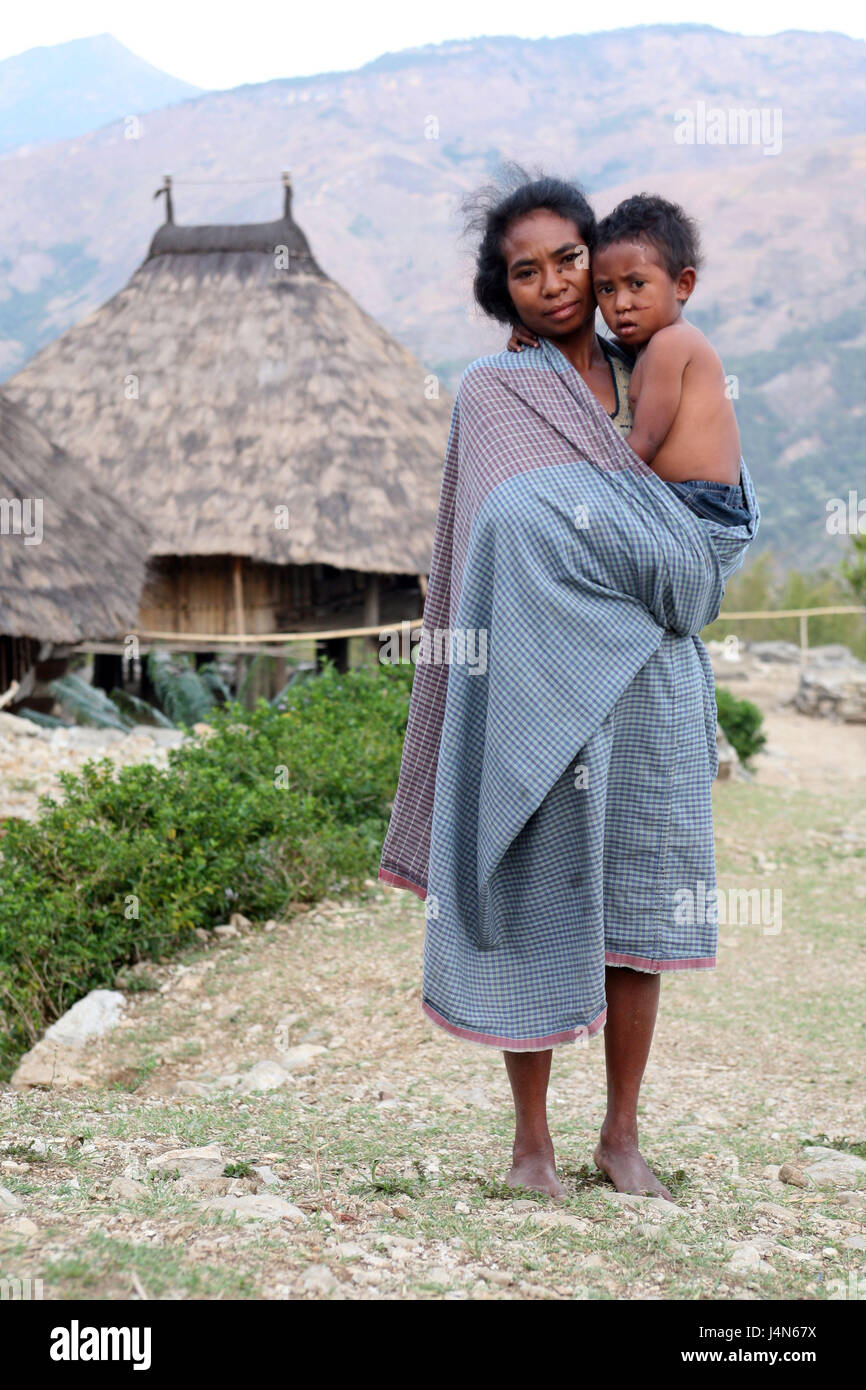 Democratic republic of Timor-Leste, poor bites, mountain region, mother, child, carry, Stock Photo