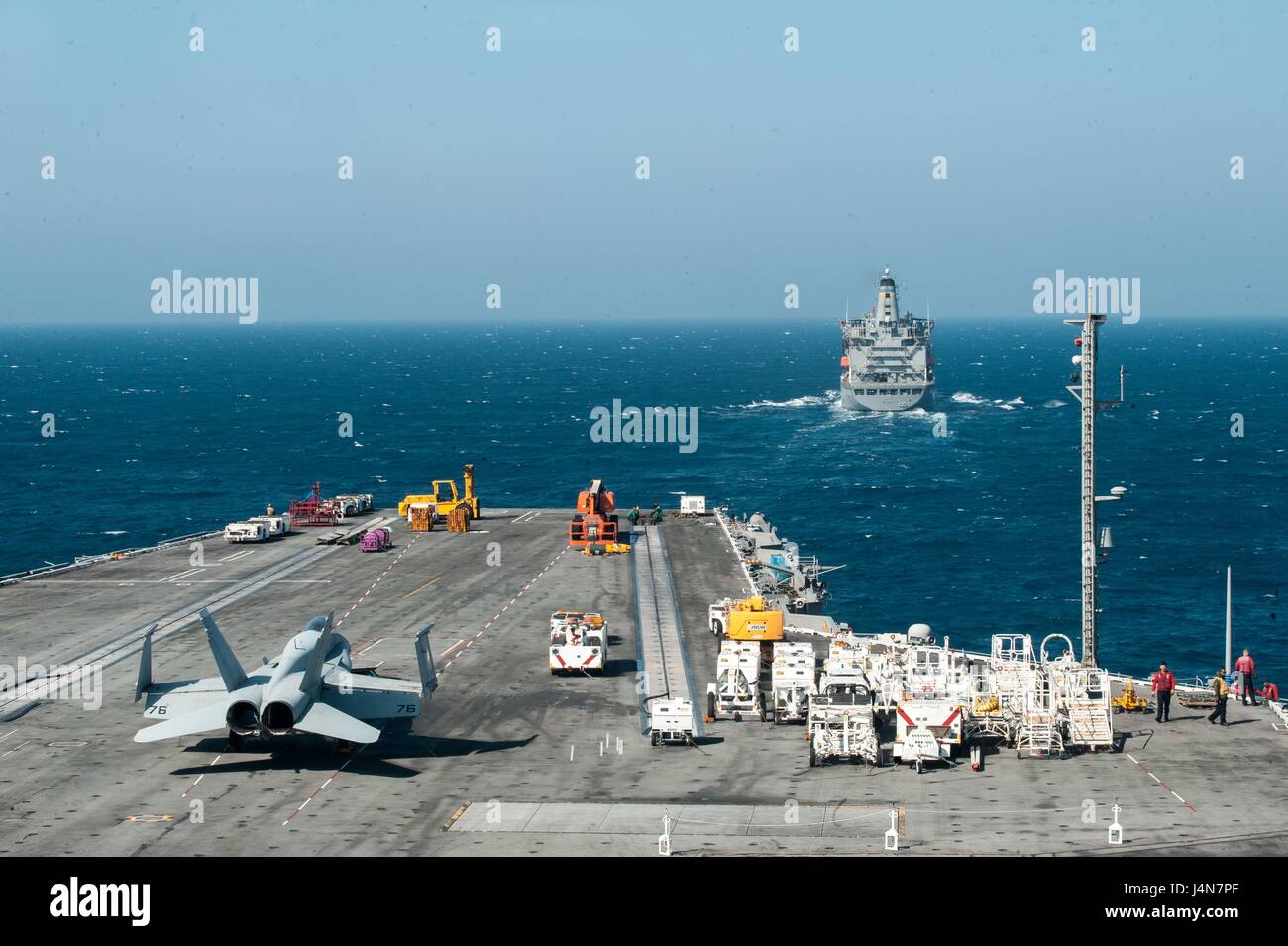 The U.S. Navy forward-deployed nuclear aircraft carrier  USS Ronald Reagan approaches the Military Sealift Command fleet replenishment oiler USNS John Ericsson  to conduct a fueling-at-sea May 11, 2017 in the Sea of Japan. Stock Photo
