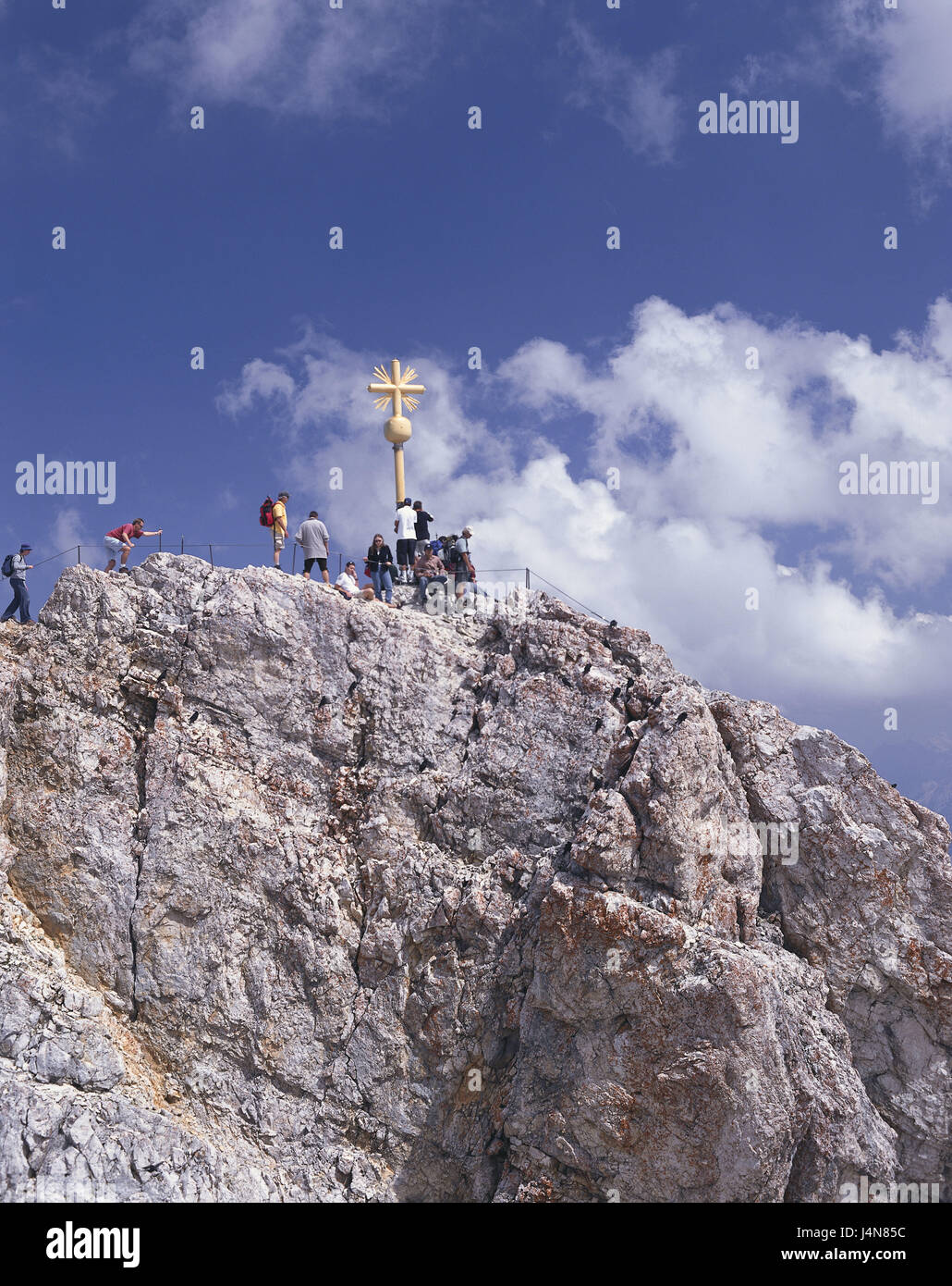 Germany, Bavaria, Zugspitze, east summits, summit cross, visitor, Upper Bavaria, alps, Wetterstein Range, Zugspitze summit, summit, cross, golden, mountain, mountaintop, lookout, mountains, place of interest, tourism, person, mountaineer, tourist, outside, summer, cloudy sky, Stock Photo