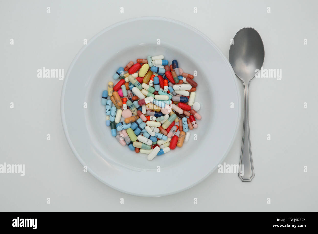Drugs, plates, tablets, capsules, spoon, Stock Photo