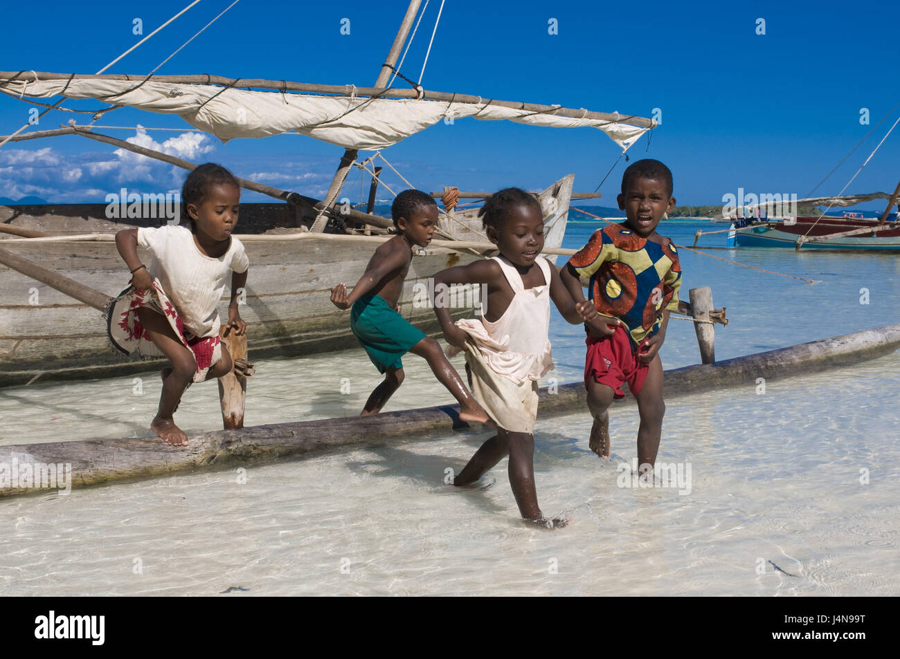 Madagascar, Nosy Iranja, children, play, sea, fishing boat, detail, no  model release Stock Photo - Alamy