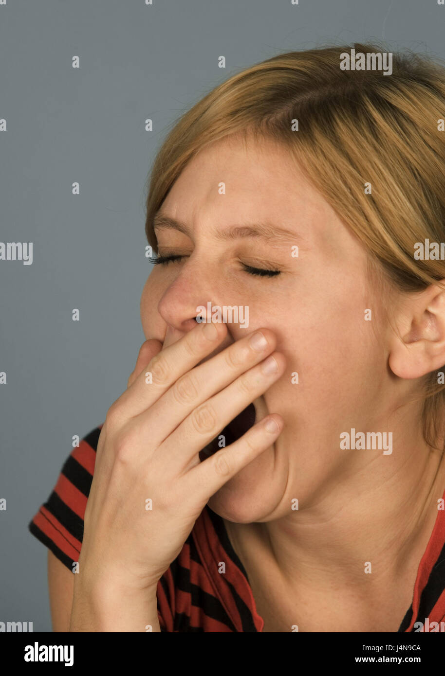 Woman, young, yawn, with hand, reproach, portrait, curled, people, young persons, blond, tiredly, fatigue, depletion, erodedly, drawn, rewrite, unslept off, oxygen starvation, studio, inside, icon, decency, behaviour, Stock Photo