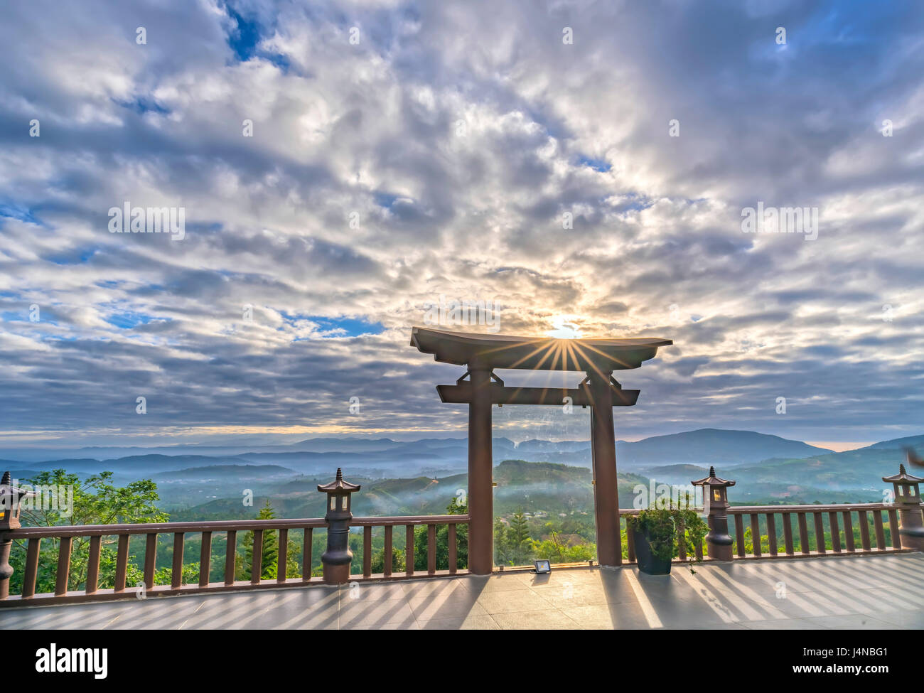 The magical sunrays of dawn on the yard 'Linh Qui Phap An' pagoda, Stock Photo