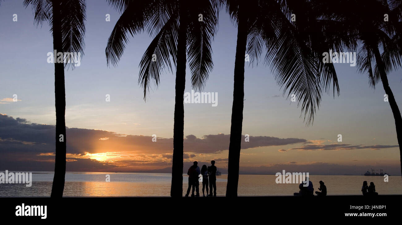 The Philippines, island Luzon, Manila, Manila Bay, palms, tourists, silhouette, sundown, destination, sea, sea view, view, palm beach, fantastically, dream vacation, beach vacation, afterglow, atmospheric, people, vacationers, romanticism, Stock Photo