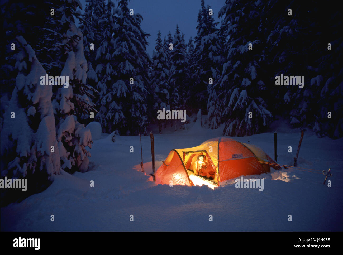 Canada, Asulkan, tent, man, tourist, lie, lights, evening tuning, snow, scenery Stock Photo