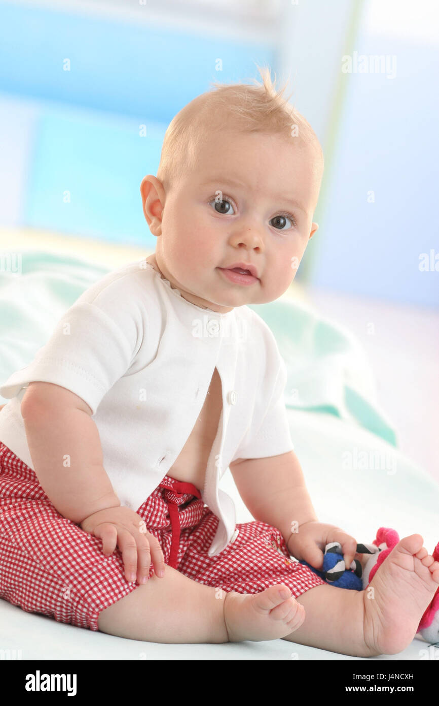 Baby, 9 months, sit, look, Stock Photo