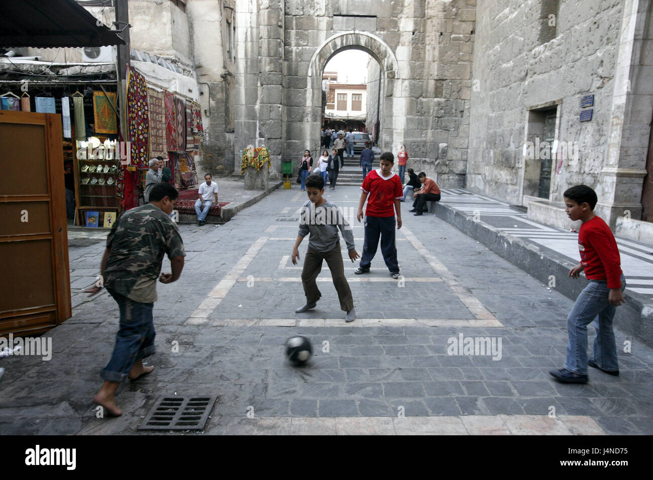 Syria, Damascus, Old Town, Umayyad mosque, lane, children, to football matches, no model release, place of interest, building, structure, architecture, person, outside, football, play, Weihrauchstrasse Stock Photo