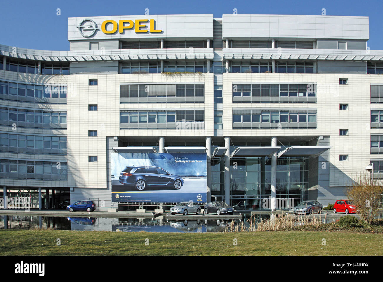 Germany, Hessen, trunk home, Opel house, outside, no property release, building, Opelhaus, Opel opus, Opelwerk, car dealer, Opel, company logo, Opel logo, logo, VEHICLE, automaker, car industry, GM, vehicles, cars, reflexion, advertisement poster, poster, advertisement, Stock Photo