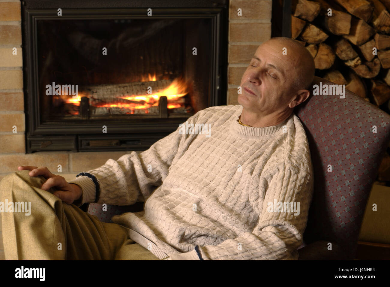 Living square, open fire, boss, sit, sleep, rest curled, people, senior citizens, man, détente, rest, take it easy, enjoy, fatigue, depletion, only, cosiness, heat, kiln, fires, flames, wooden kiln, chimney, Stock Photo