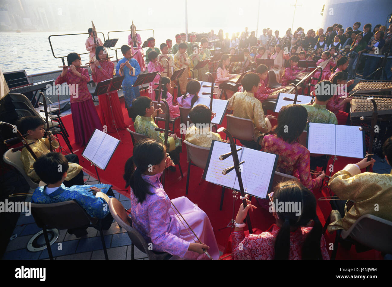 China, Hong Kong, Kowloon, orchestra, music, Asia, town, city, cosmopolitan city, metropolis, children, young persons, people, Asians, showing, performance, make music, musical instruments, traditionally, in Chinese, Stock Photo