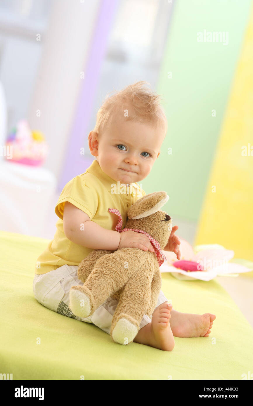 Baby, boy, 7 months, sit, smile at the side, view camera, soft hare, model released, not freely for magazine title Mk/Rb people, infant, girl, dresses, blond, nonsense animal, soft toy, toys, play, view, mischievously, Indoor, portrait, title, Stock Photo