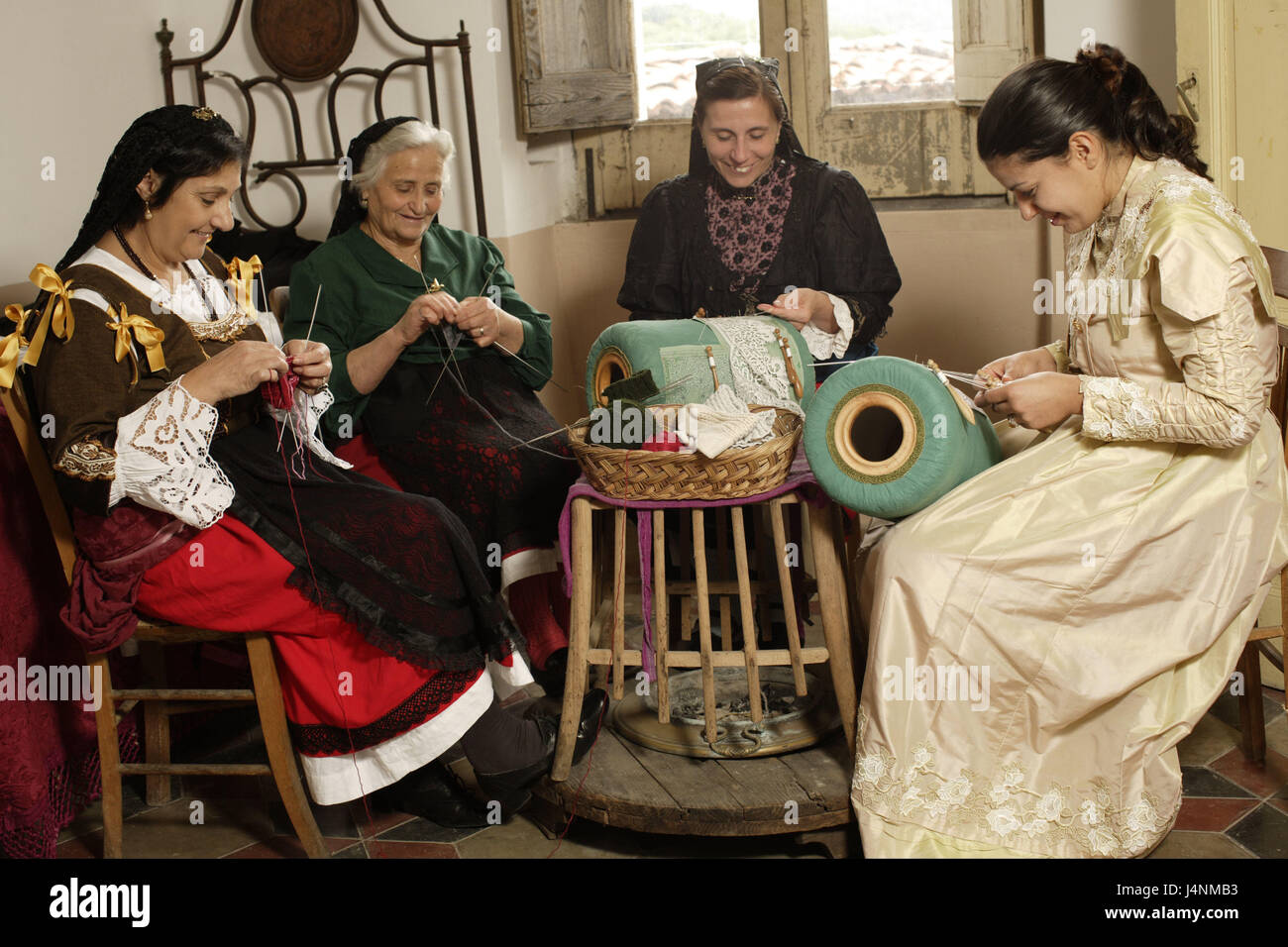 Italy, Calabria, Serrastretta, women, manual labours, together, Süditalien, people, senior citizens, seniors, national costume, folklore clothes, headgear, sit, manual labour, knitting, make lace, attach, craft art, work, occupation, tradition, inside, Stock Photo