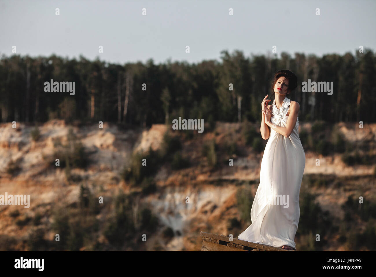 girl in white dress on a riverside Stock Photo - Alamy