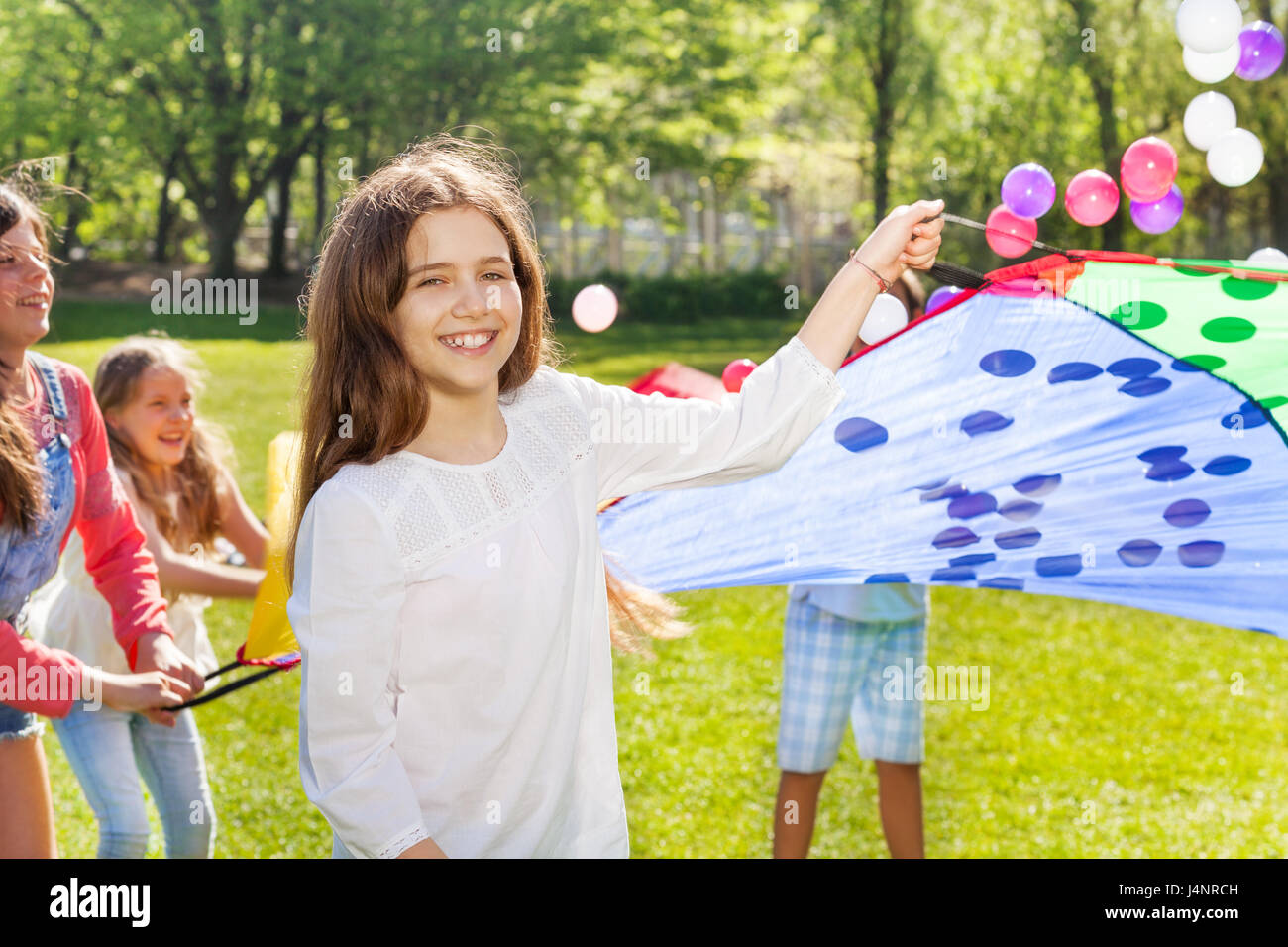 Children throwing ball together hi-res stock photography and images - Alamy