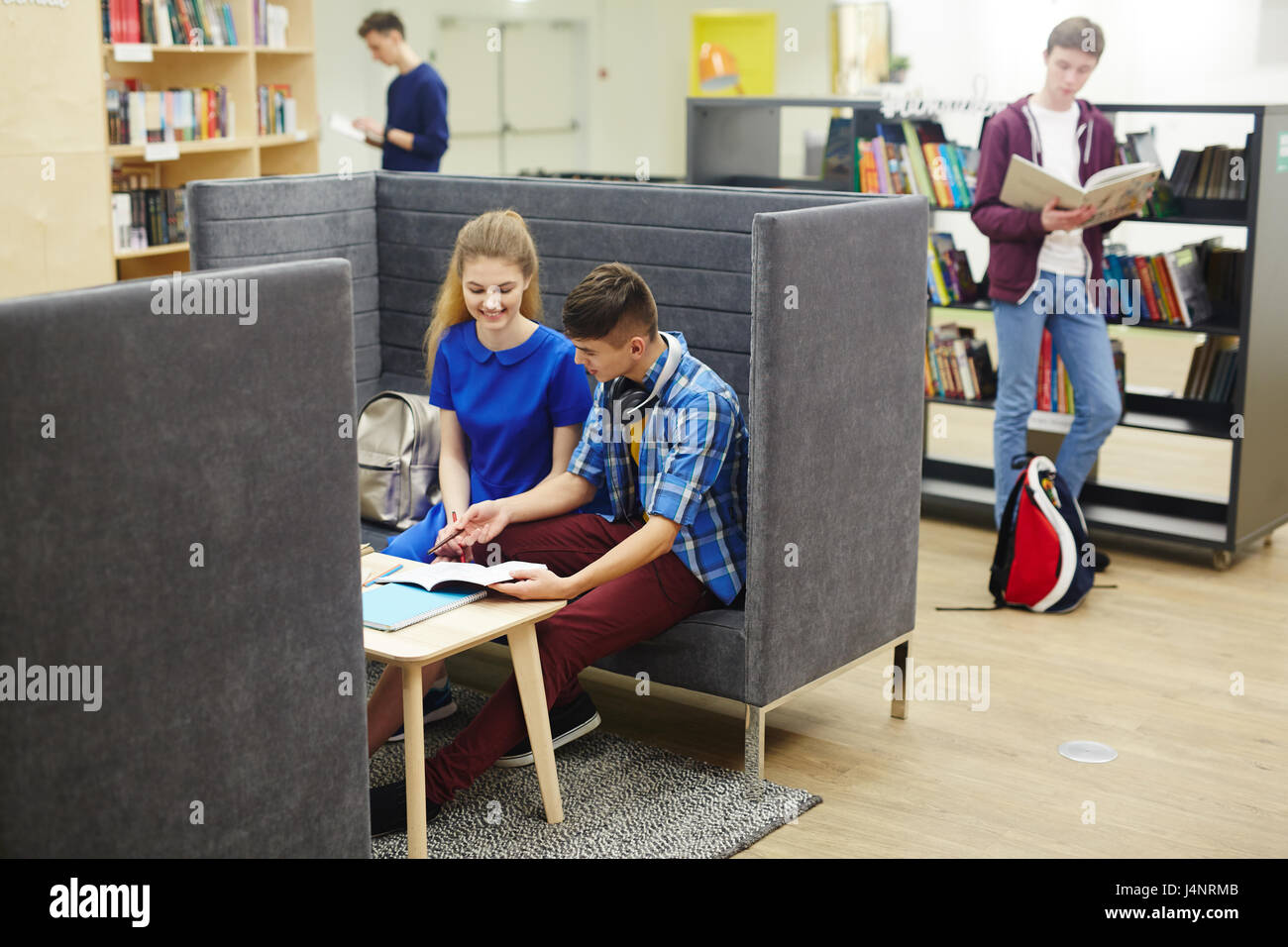 Clever guy explaining task to his groupmate Stock Photo Alamy