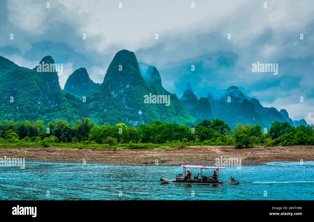 Karst mountains and Li River scenery in the mist Stock Photo - Alamy